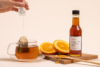 Populum's CBD + Orange Raw Honey used with tea for sweetness and a dose of CBD